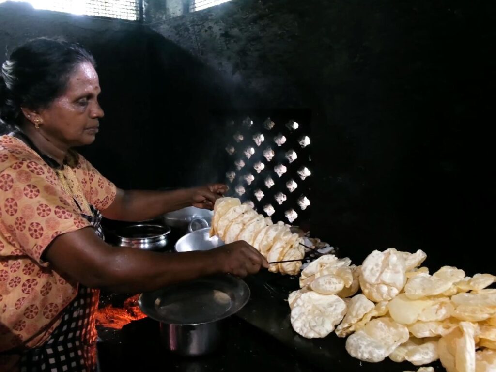 Making Pappadam at Krishna Hotel