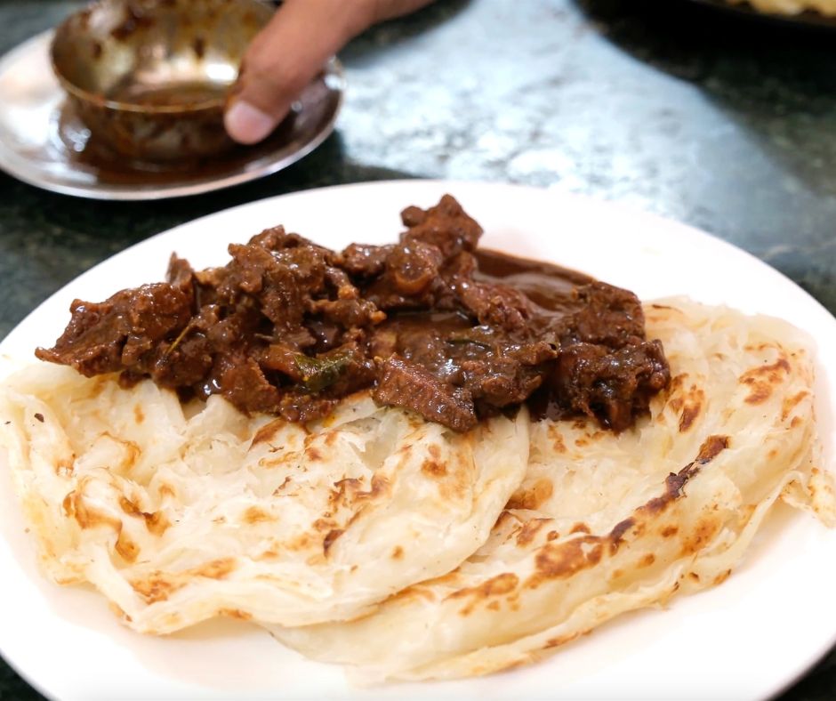 Parotta and beef curry at Best Hotel Pattimattom