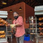 Posing with Shawaya Chickens at T&T Shawaya Kochi